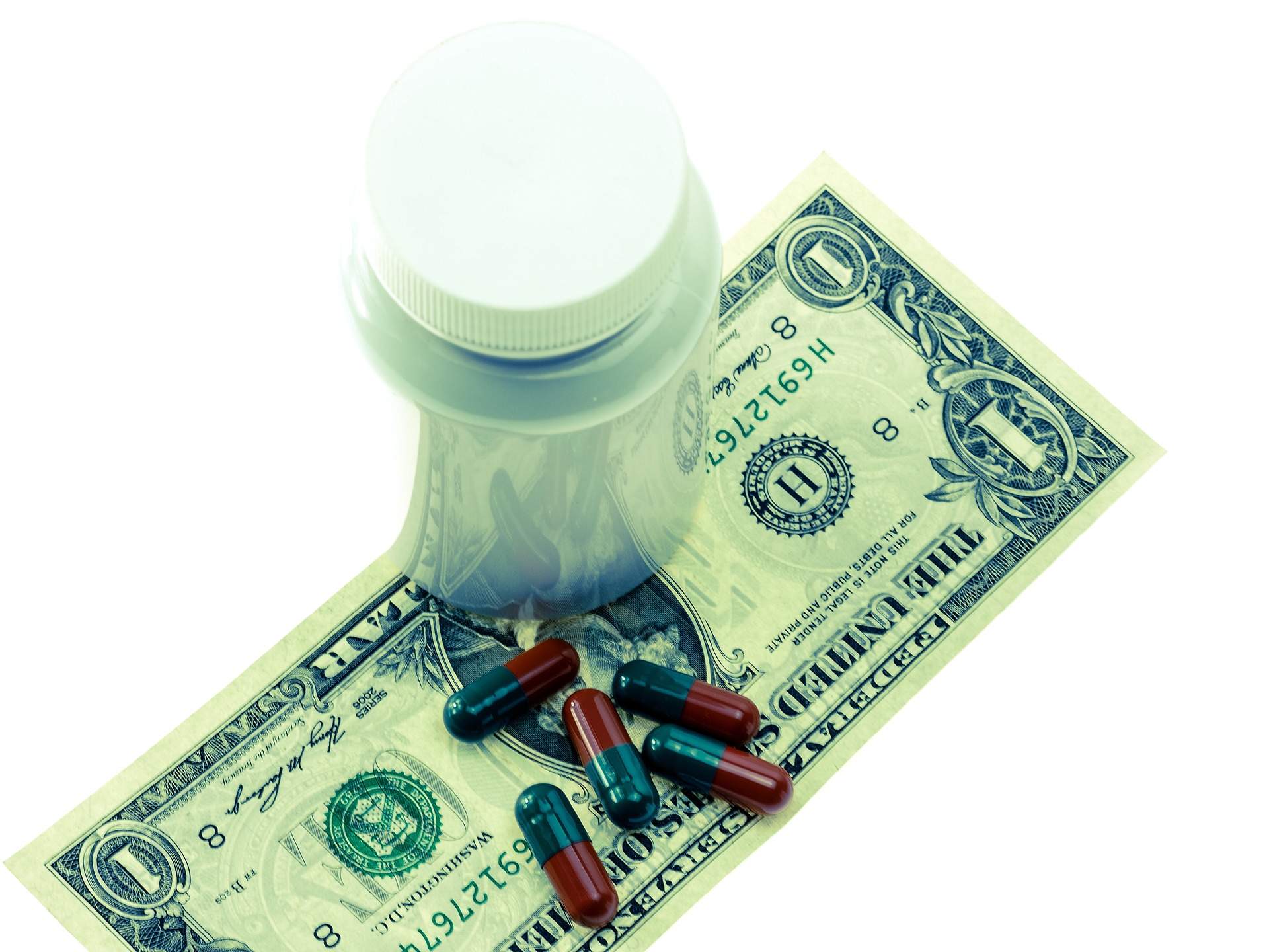 dollar bill with drugs and pills - free stock image via Pixabay