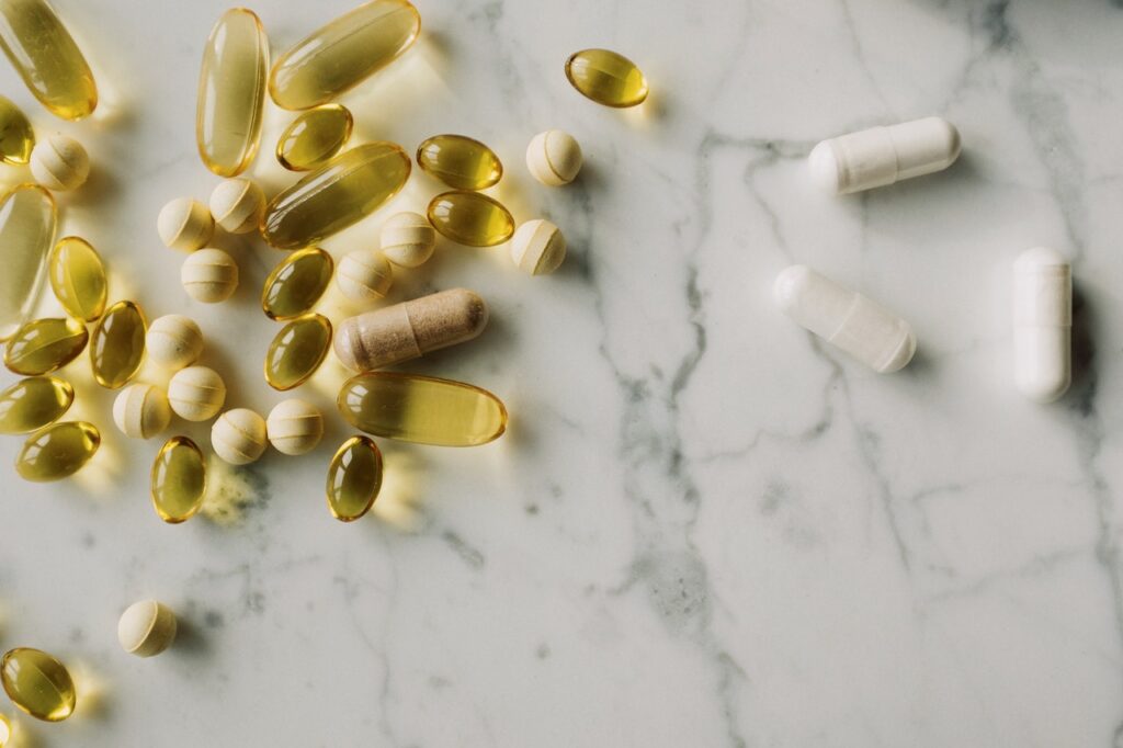 image of drugs medicine pills on a countertop - free stock image via Pexels