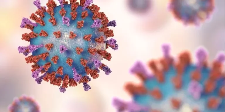 Digital Image of an RSV virus, colored blue and red with a light pink and yellow background.