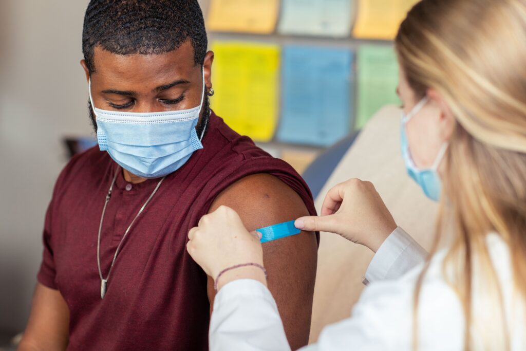 image from the CDC of an adult getting a vaccine