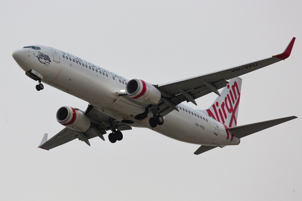 Virgin Atlantic airplane in the sky - Troy Mortier (@troyscanon) via Unsplash