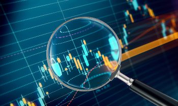 Magnifier Focusing On A Financial and Technical Data Analysis Graph Magnifier focusing on a financial data analysis graph. Selective focus. Horizontal composition with copy space.