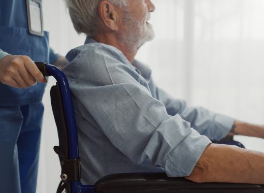 Nurse putting wheelchair with senior man  window. Unhappy senior man having geriatric or depression disease. Therapist taking care, giving support and empathy.