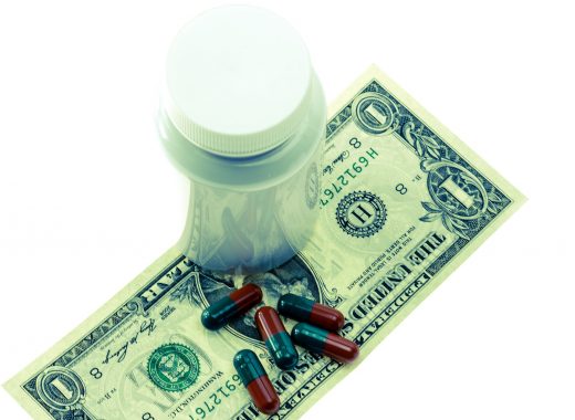 dollar bill with drugs and pills - free stock image via Pixabay