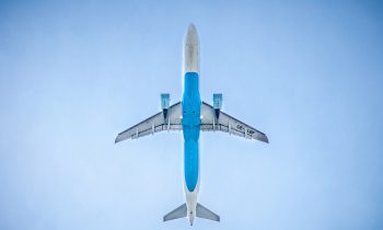 view of airplane in the sky to advance sustainable air travel